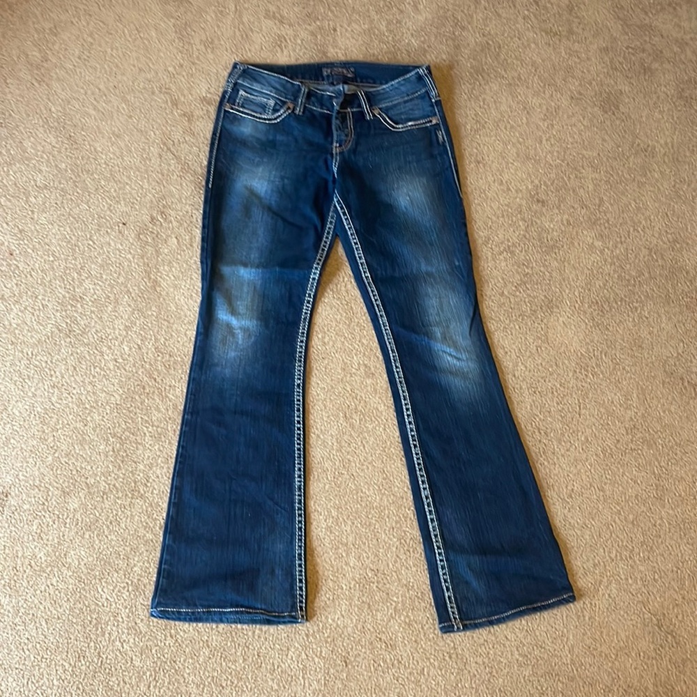 Silver suki mid rise flare jeans.